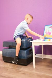 kid sitting on the REST chair
